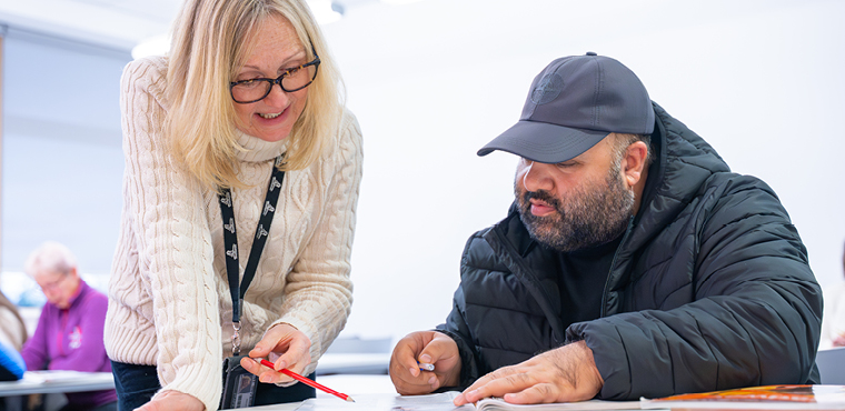 UHI Inverness student and lecturer working in classroom UHI Inverness student and lecturer working in classroom
