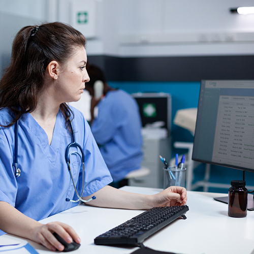 A medical professional using a computer