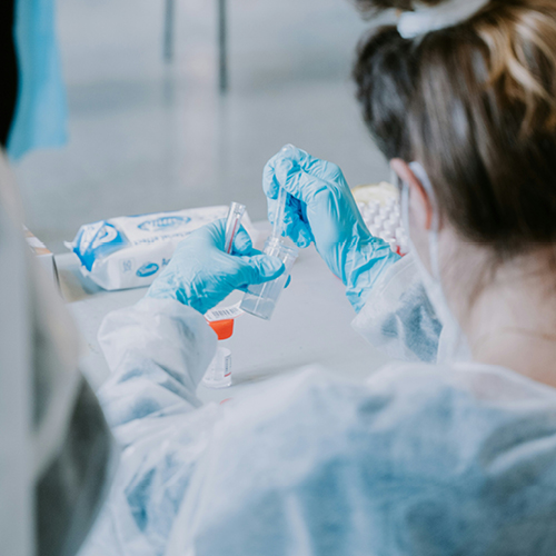 A medical professional using medical tools