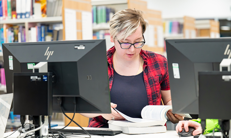 UHI Inverness student working in the campus library UHI Inverness student working in the campus library