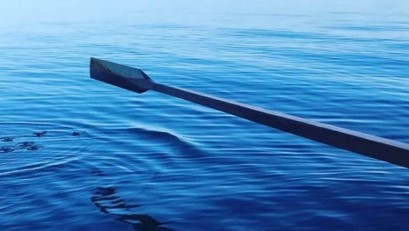 Oar above calm water