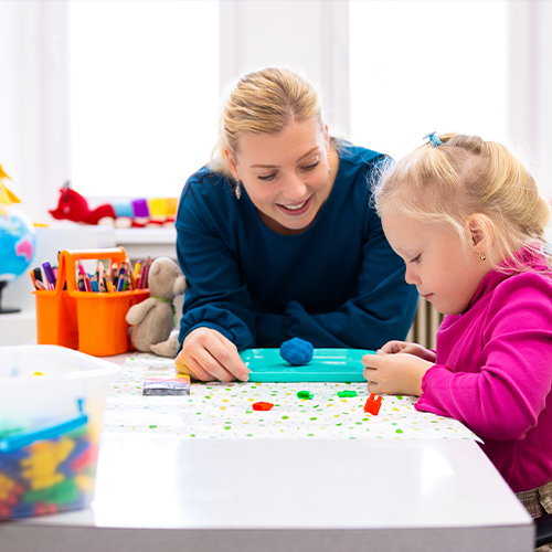 women and child doing sensory activities